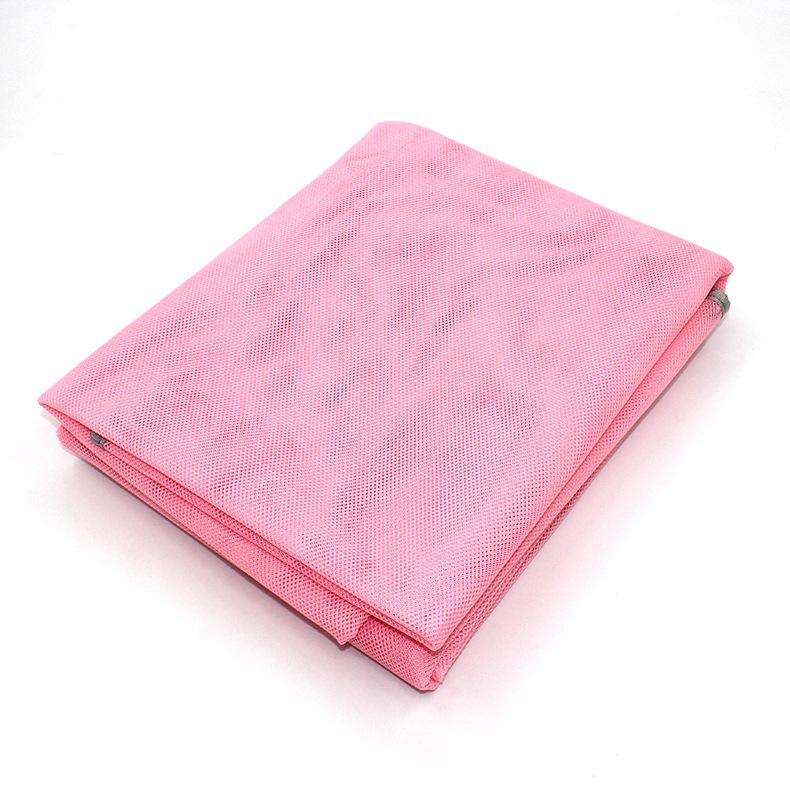 Folded Waterproof Sand Free Beach Mat in pink over a white background