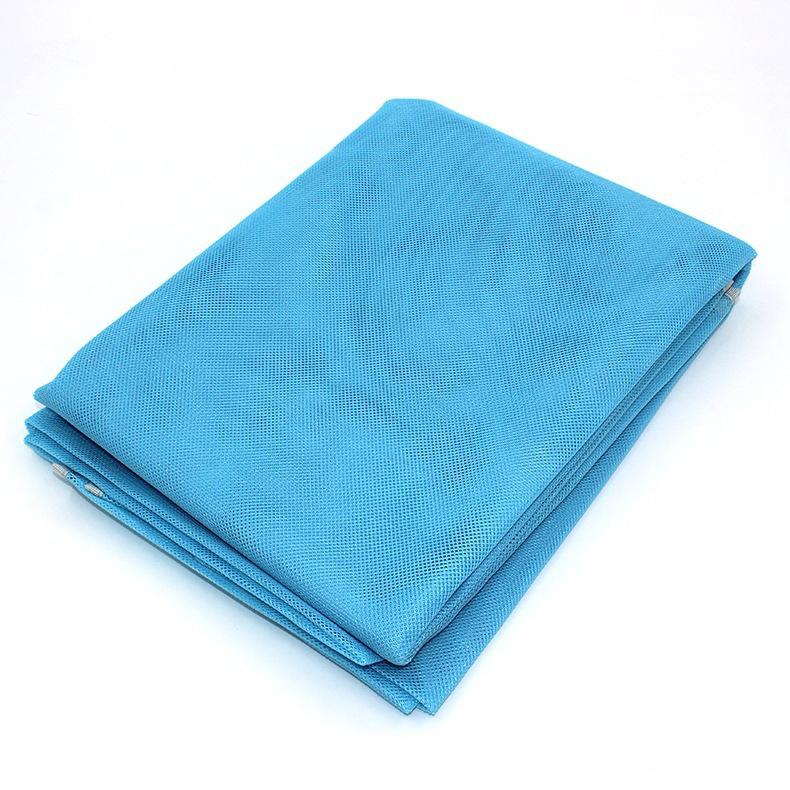 Folded Waterproof Sand Free Beach Mat in blue over a white background