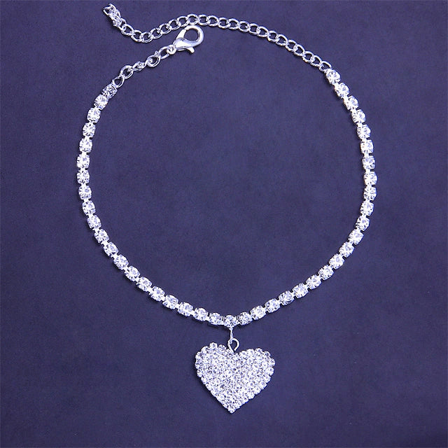 Silver Women's Ankle Bracelet laid out on a blue surface