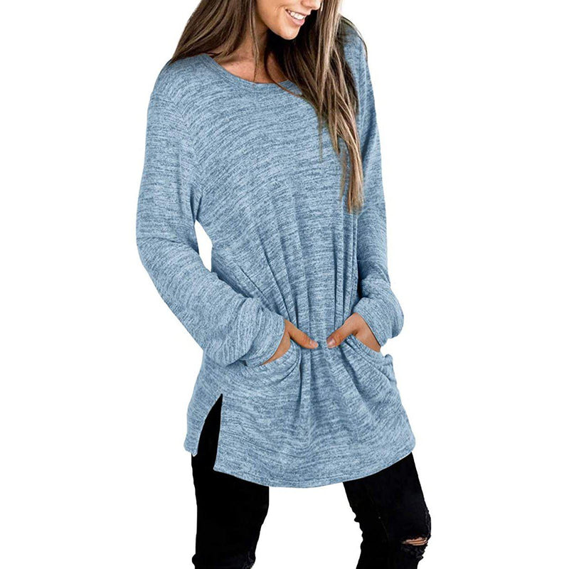 3/4 front view of a smiling woman with her hands in her pockets wearing a Women's Sleeve Oversized Casual Sweatshirts in blue