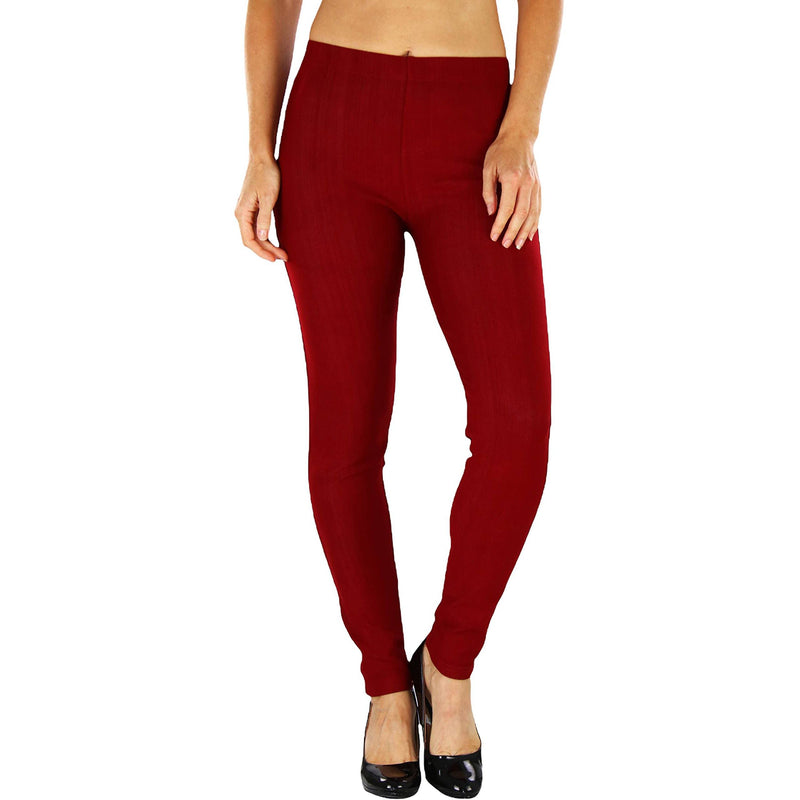 Woman with hands on her side shown below her hips wearing Easy Pull-On Denim Skinny Fit Comfort Stretch Jeggings in burgundy
