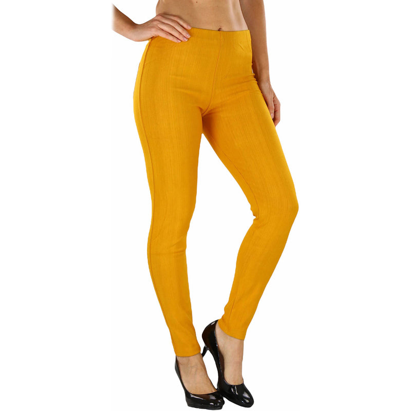 Woman with hands on her side shown below her hips wearing Easy Pull-On Denim Skinny Fit Comfort Stretch Jeggings in mustard
