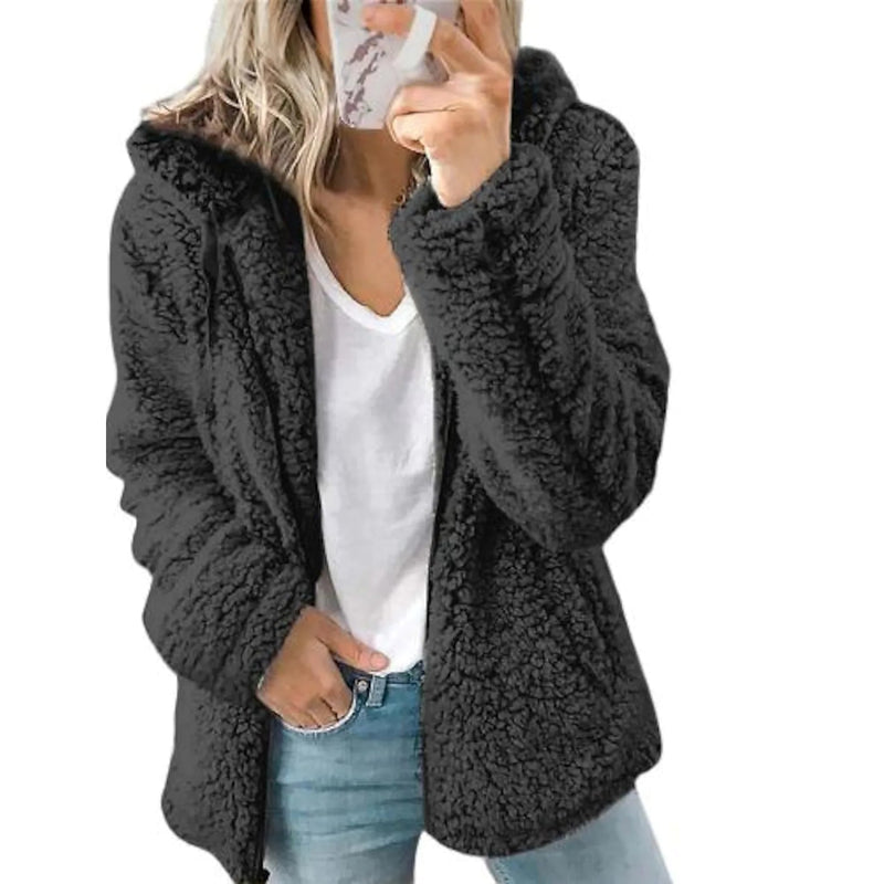 Women holding a smartphone wearing a black Plus Size Hoodie Coat Long Sleeve, available at Dailysale