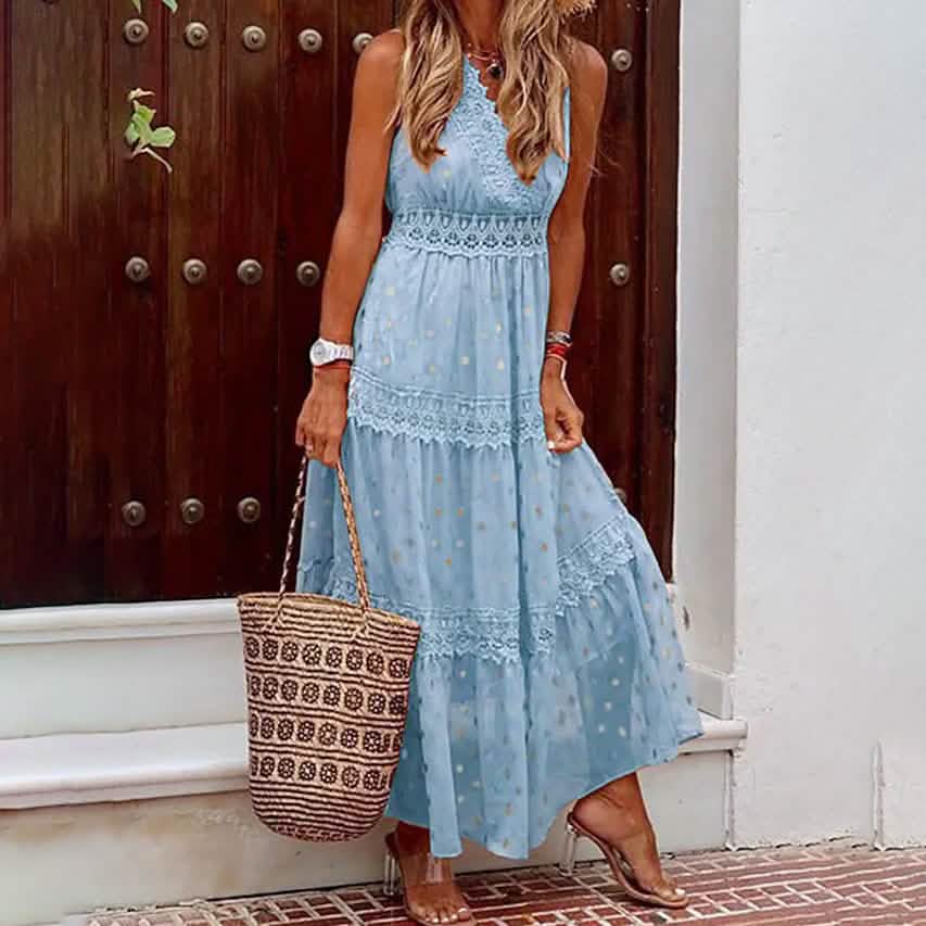 Woman holding a purse with one hand wearing a Sleeveless Solid Color Lace Panel Dress in blue
