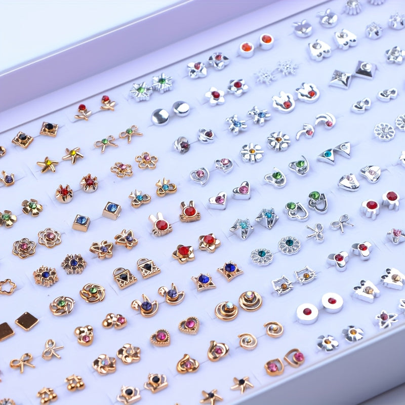 Display of assorted gold-tone and silver-tone stud earrings with rhinestone designs