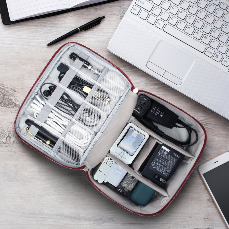 Organizer open on a desk beside a laptop