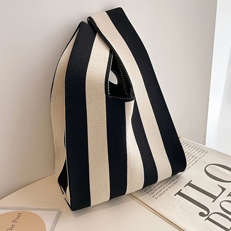 Knot tote standing upright showing the handle loop