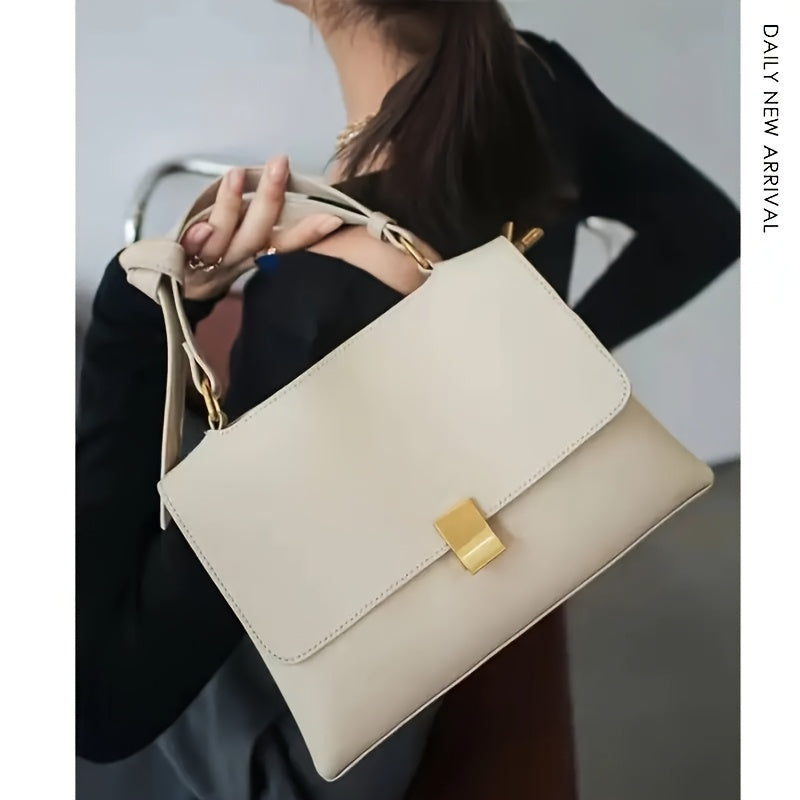 Cream bag carried on the shoulder