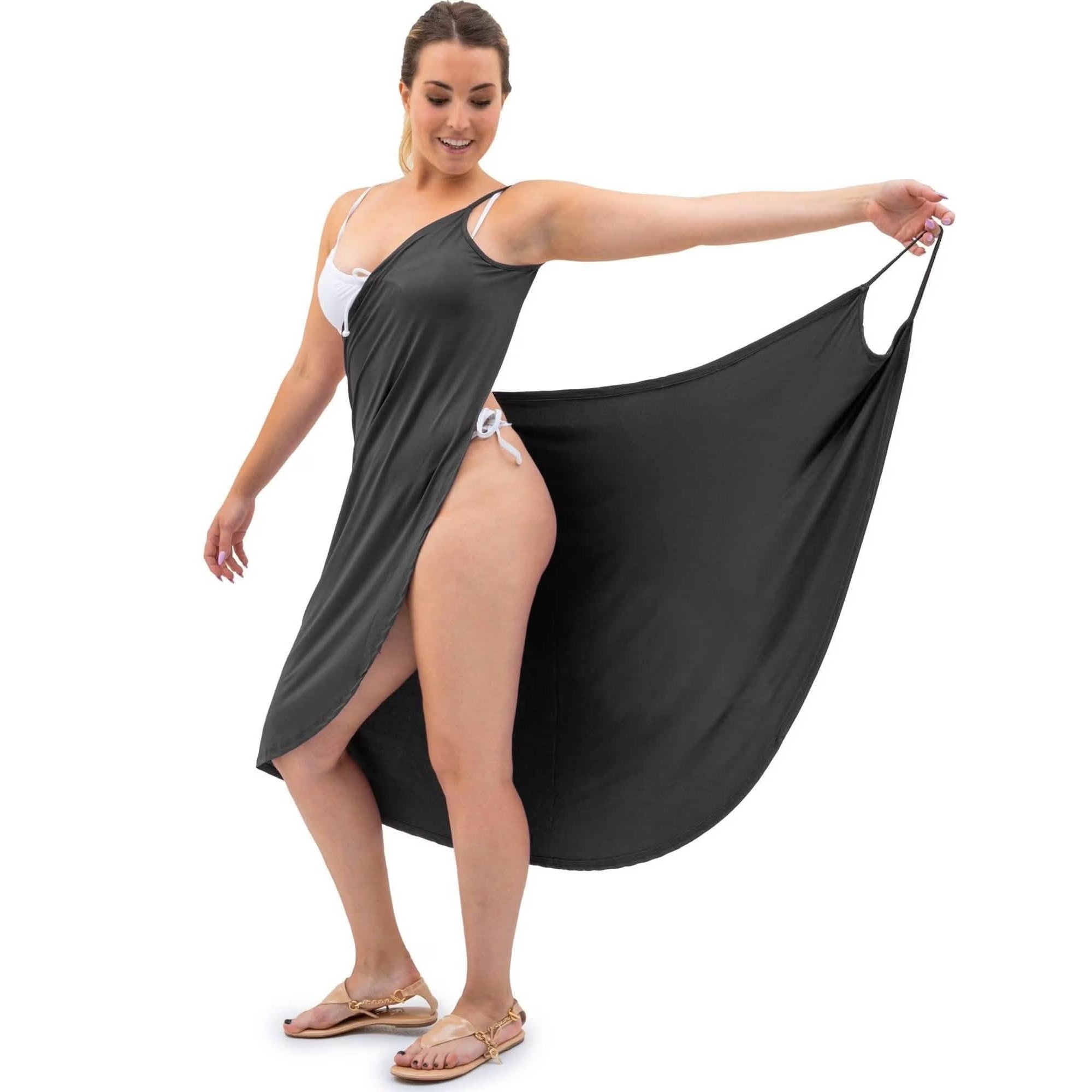 Woman wearing the grey wearable bath towel wrap, holding it open