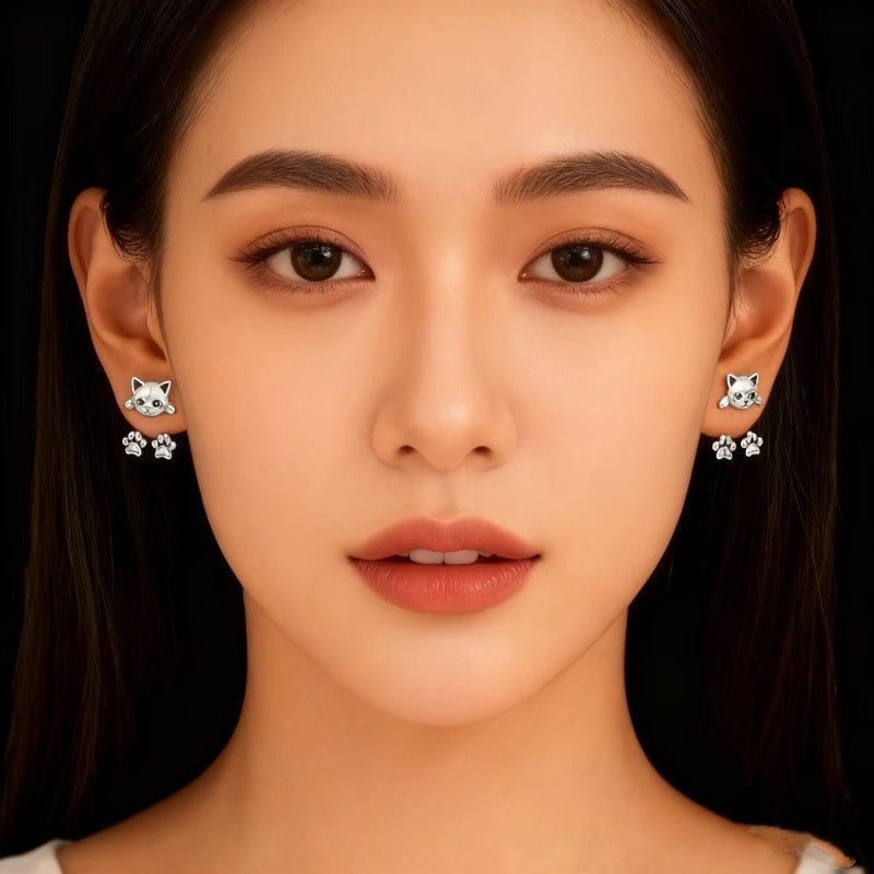 Model wearing the pair, showing how small they sit against the ear