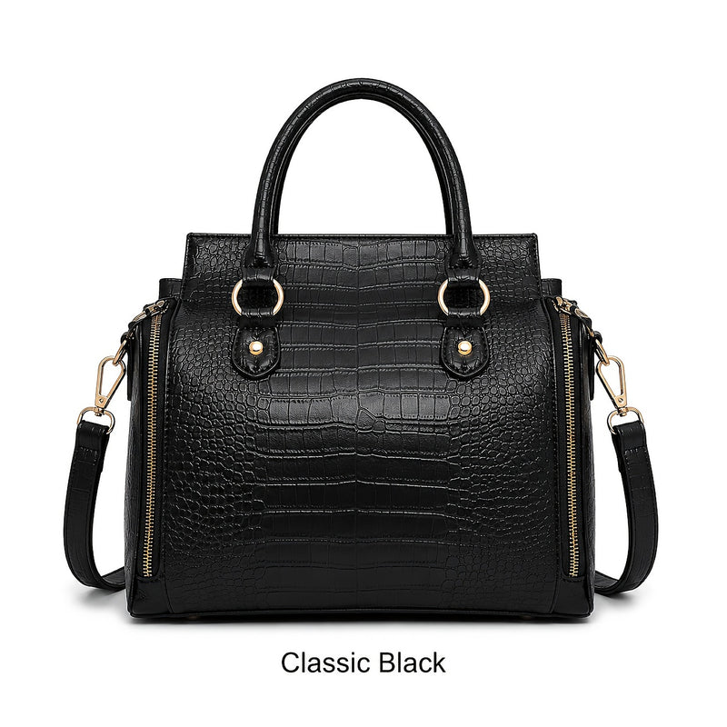 The bag in Classic Black, front view with the crossbody strap attached