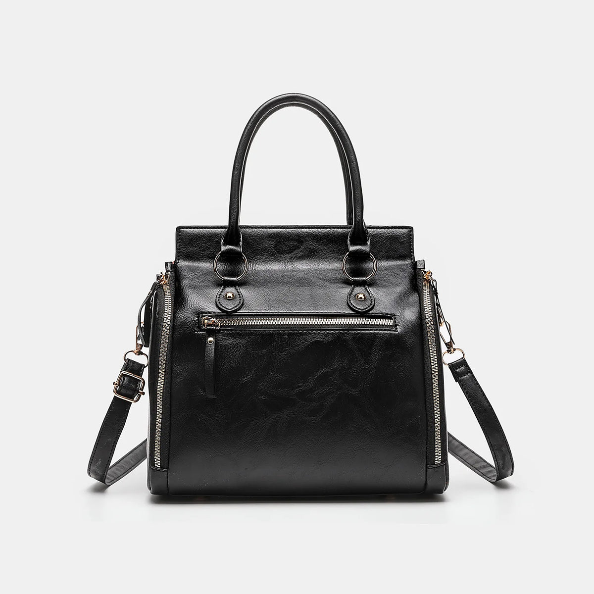 The bag in black, front view with the crossbody strap clipped on