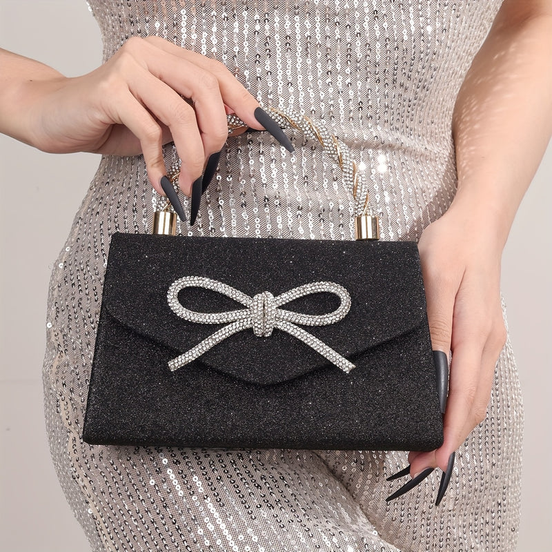 Black glitter clutch held by the braided rhinestone handle