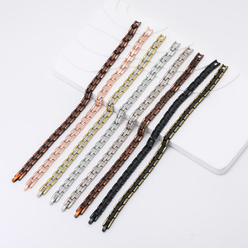 Magnetic link bracelets laid flat showing rose gold, silver, gold and black finishes