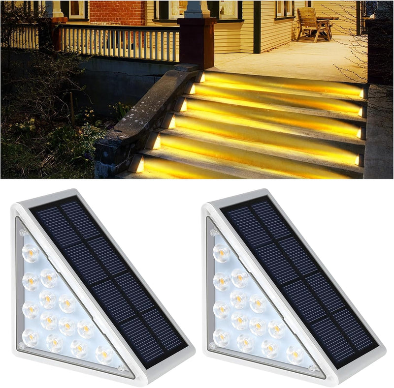 Two solar step lights and a staircase lit with warm white light