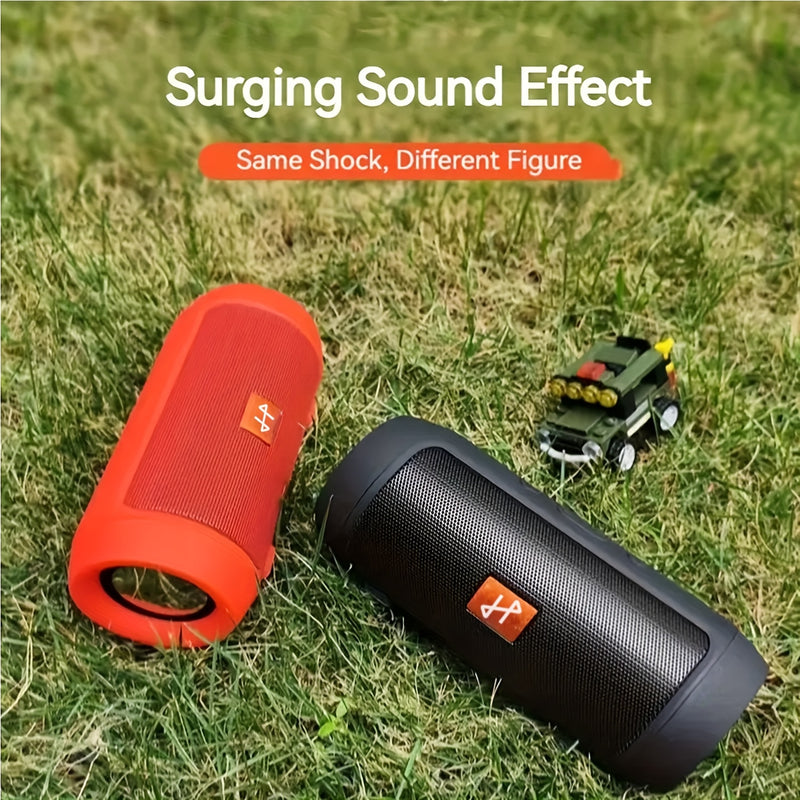 Red and black speakers outdoors on grass