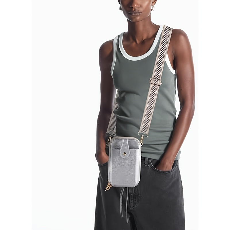 Silver bag worn crossbody