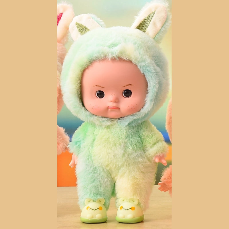 Mint green plush onesie doll with eyes open, standing