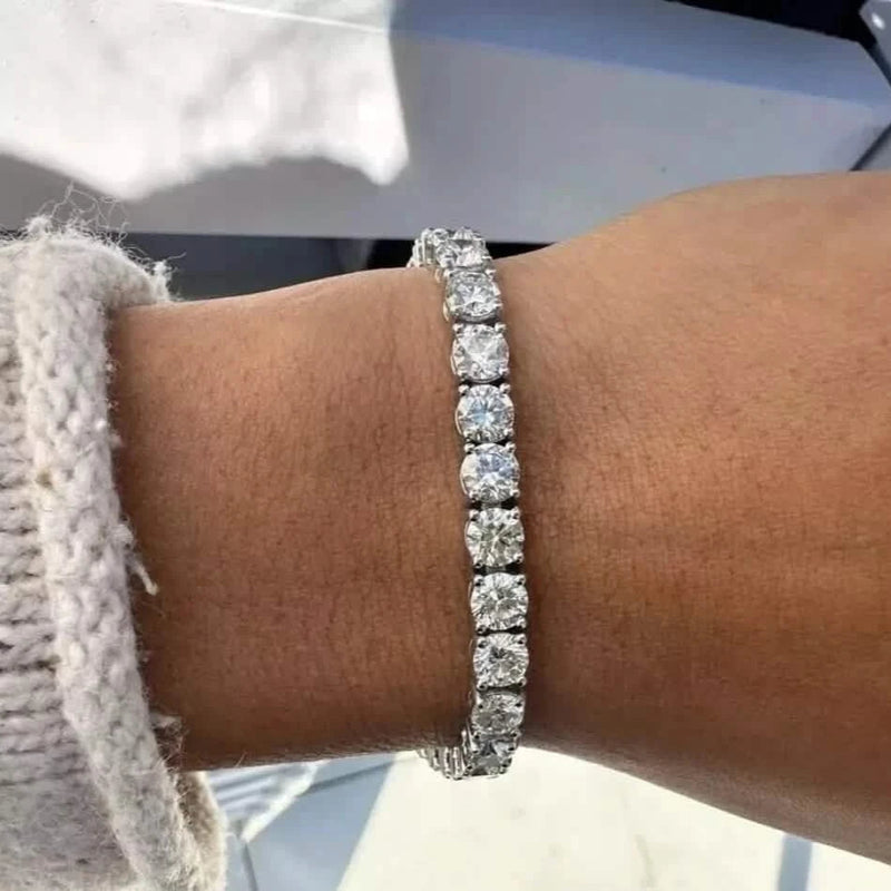 Silver bracelet on a wrist with a blurred background