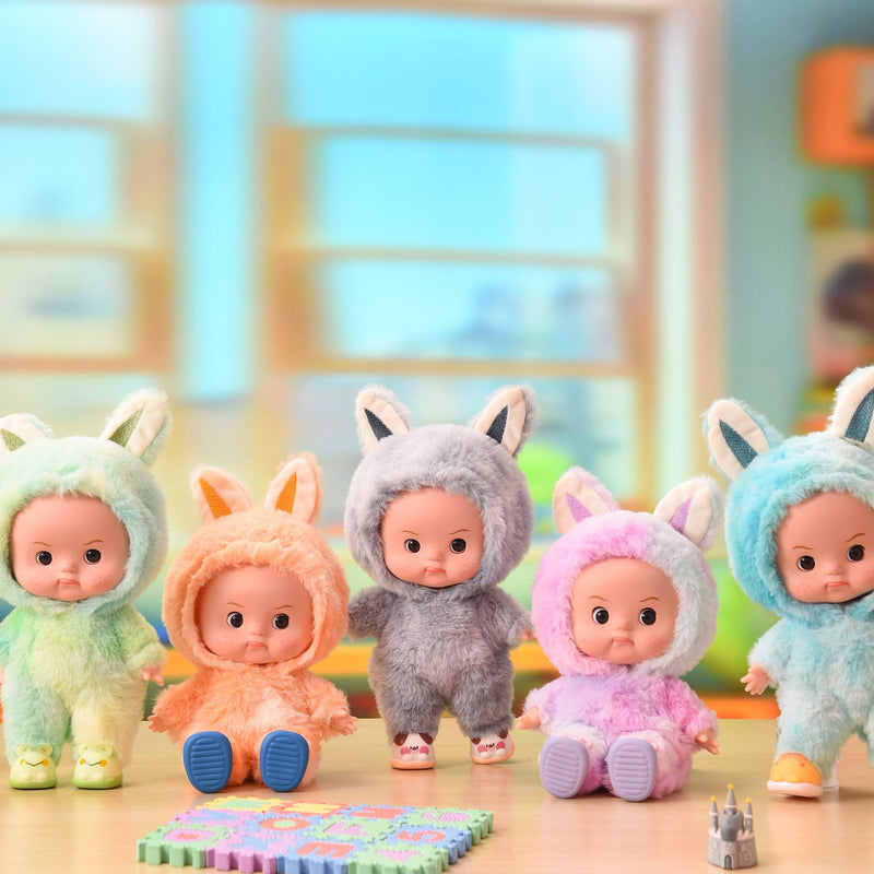 Eyes open dolls in plush animal onesies, several styles together