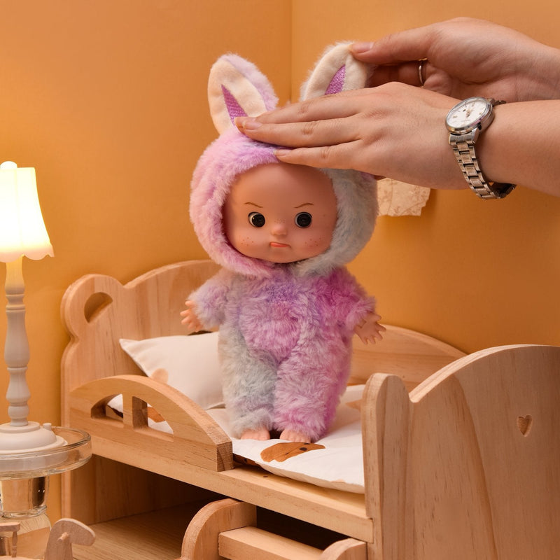 Eyes open doll held in a hand to show its size