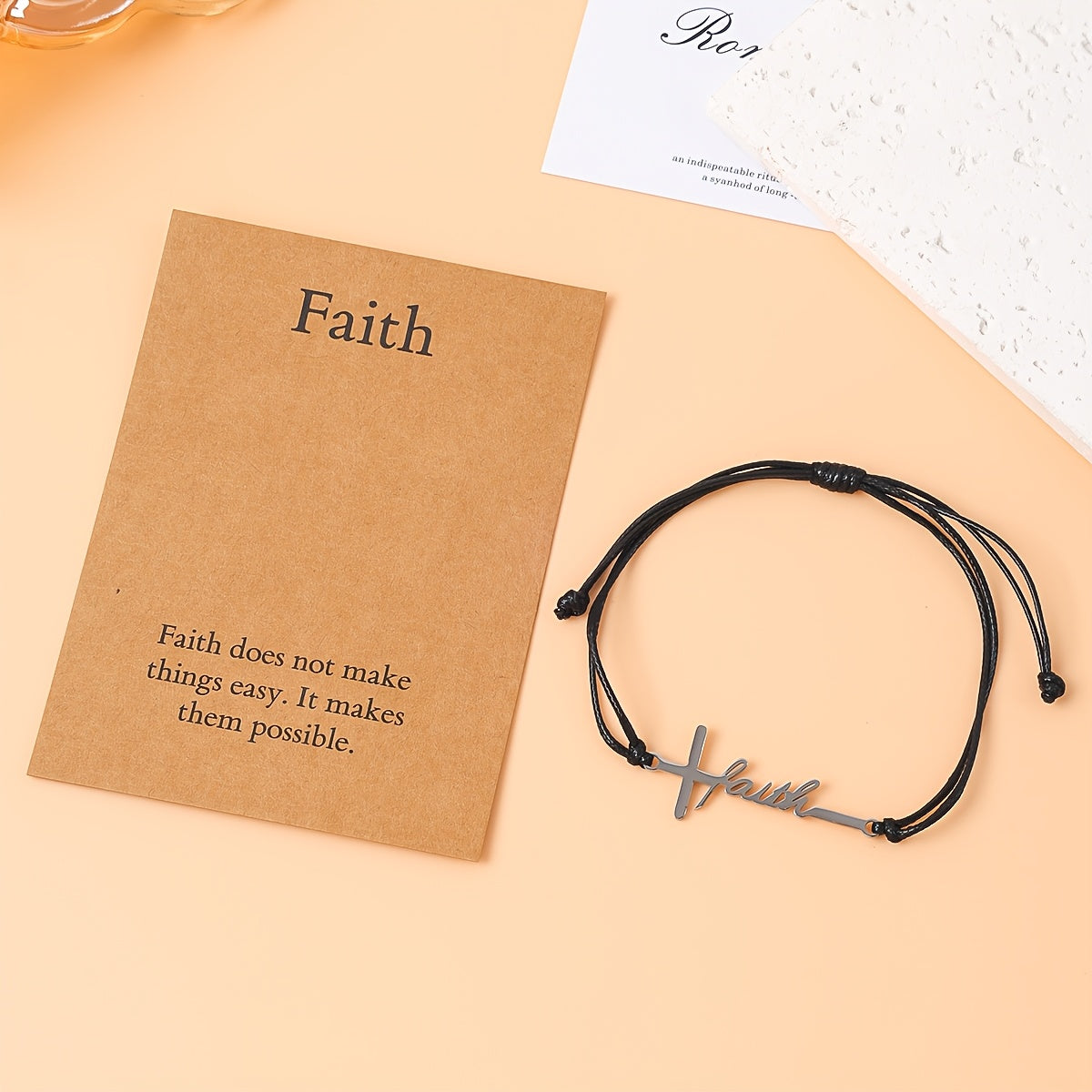 Faith bracelet off the card showing the adjustable braided cord and slide knots
