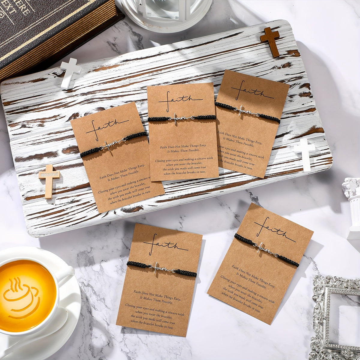Faith cord bracelets on kraft cards styled with wooden crosses and a coffee cup