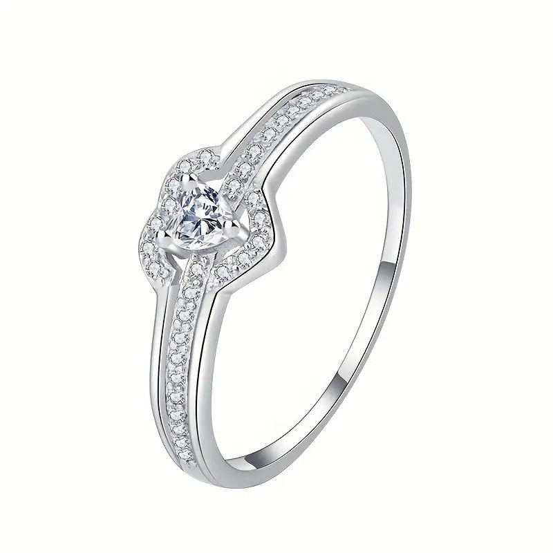 Silver heart ring with zirconia on a white background