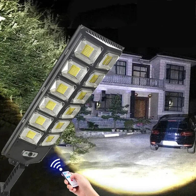Solar street light lighting a driveway at night
