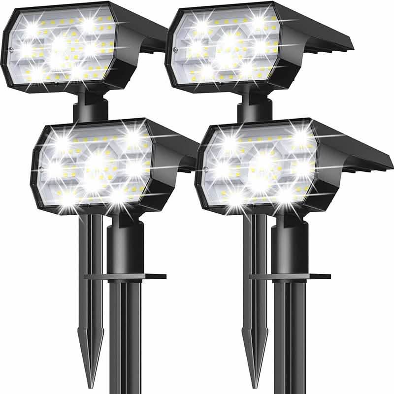 Four solar landscape spotlights on ground stakes