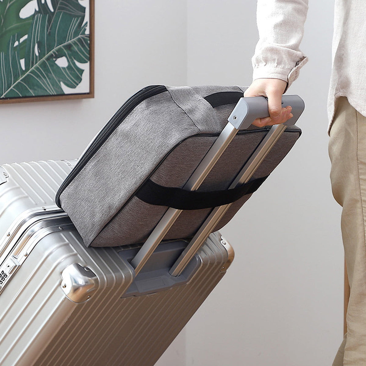 Back strap sliding over a suitcase handle