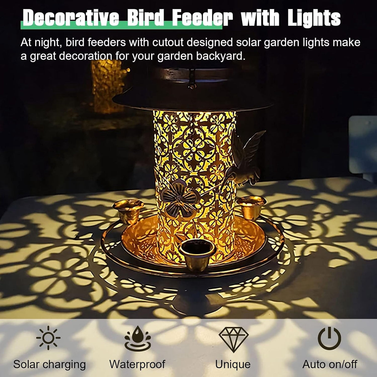 The feeder lit at night casting patterned light across a table