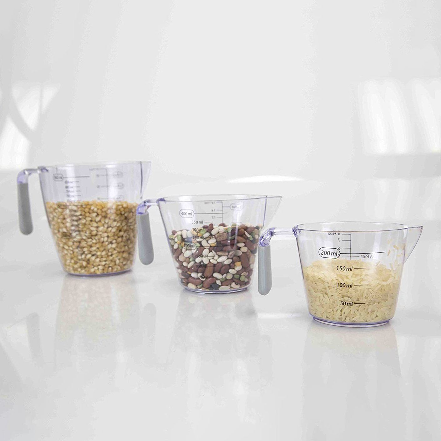 https://dailysale.com/cdn/shop/products/3-piece-home-basics-clear-plastic-measuring-cup-set-with-rubber-grip-handles-kitchen-dining-dailysale-324036.jpg?v=1607148954