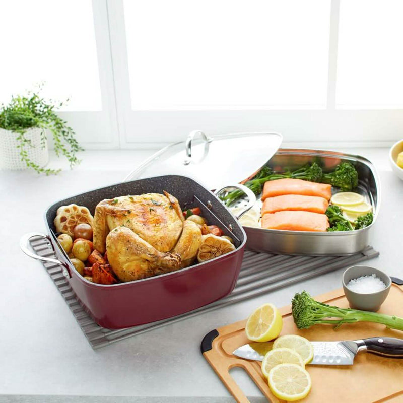 4-Piece Curtis Stone Dura-Pan Chef Square Saute Set (Refurbished) spread on a kitchen table with different dishes