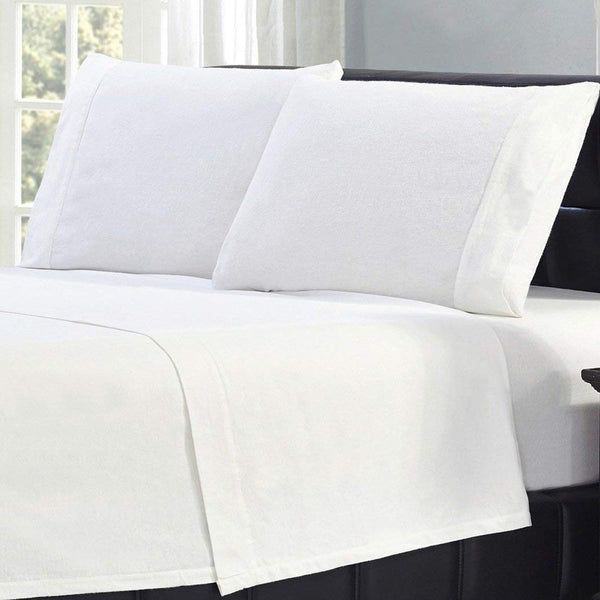 Bibb Home 100% Cotton Solid Flannel Sheet Set on display on a bed in beige