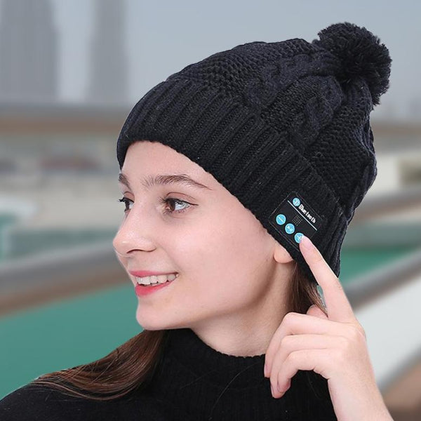 Girl with her head turned to the right wearing a Bluetooth Pom-Pom Beanie in black, available at Dailysale