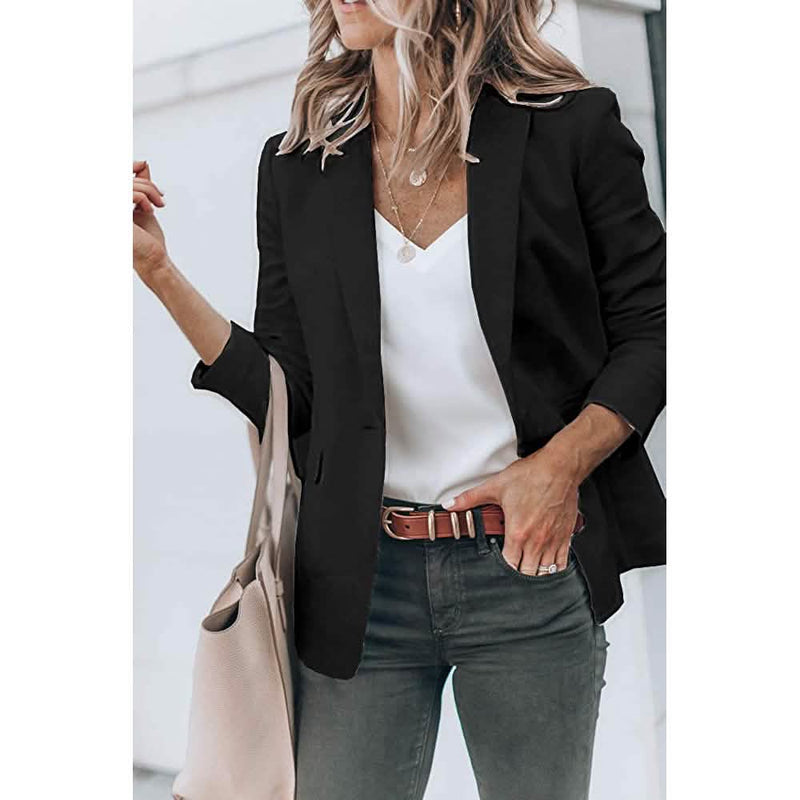 Woman holding her purse in the crook of her arm wearing a Cicy Bell Womens Casual Blazer, shown in black
