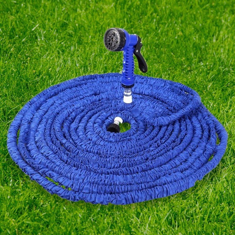 Expandable Collapsible Garden Hose shown laying down on a bed of lawn