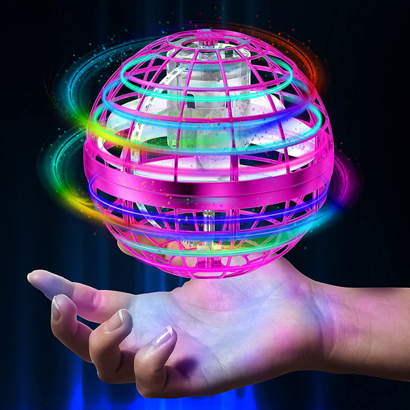 Pink flying Orb Ball Rechargeable Boomerang Spinner UFO Drone Toy hovering over a hand