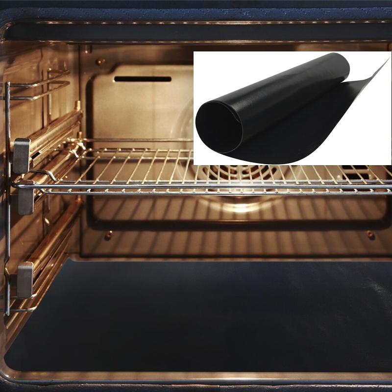 Open oven showcasing a Heavy-Duty Nonstick Oven Liner rolled up