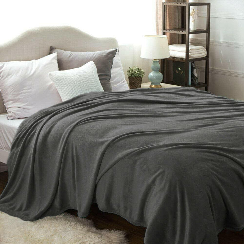 Kathy Ireland Flannel Solid Microplush Bed Blankets