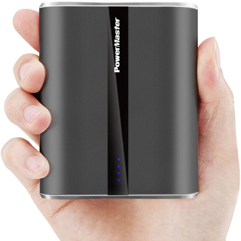 Closeup of a hand holding a dark grey Powermaster 12000mAh Portable Charger with Dual USB Ports to demonstrate sizing