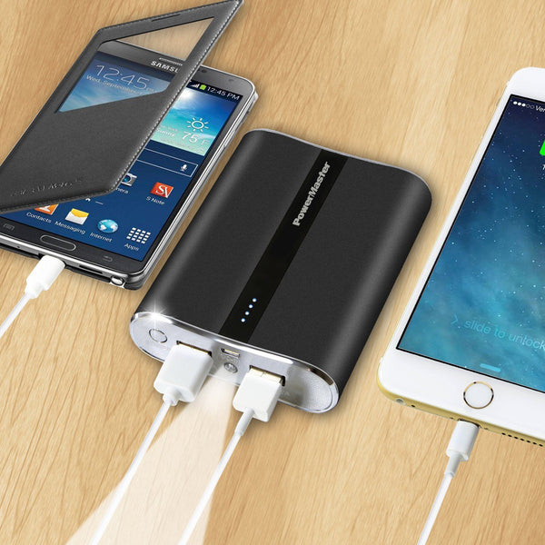 Powermaster 12000mAh Portable Charger with Dual USB Ports 3.1A Output shown charging both a phone and an iPad