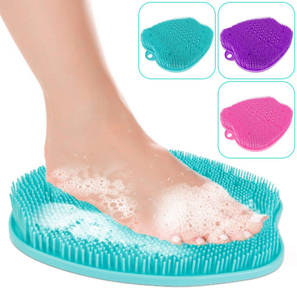 Closeup of a woman's foot using a Shower Foot Scrubber Mat, available at Dailysale