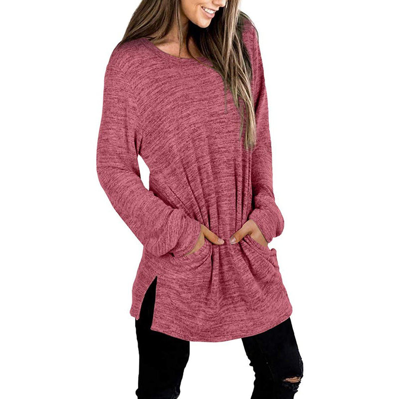 3/4 front view of a smiling woman with her hands in her pockets wearing a Women's Sleeve Oversized Casual Sweatshirts in red