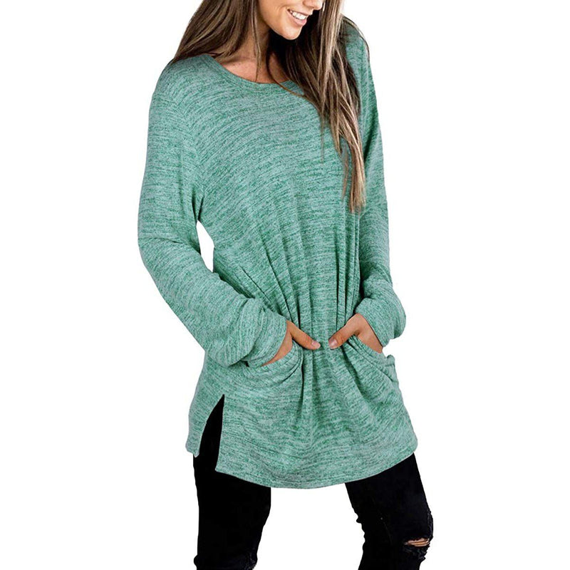 3/4 front view of a smiling woman with her hands in her pockets wearing a Women's Sleeve Oversized Casual Sweatshirts in green