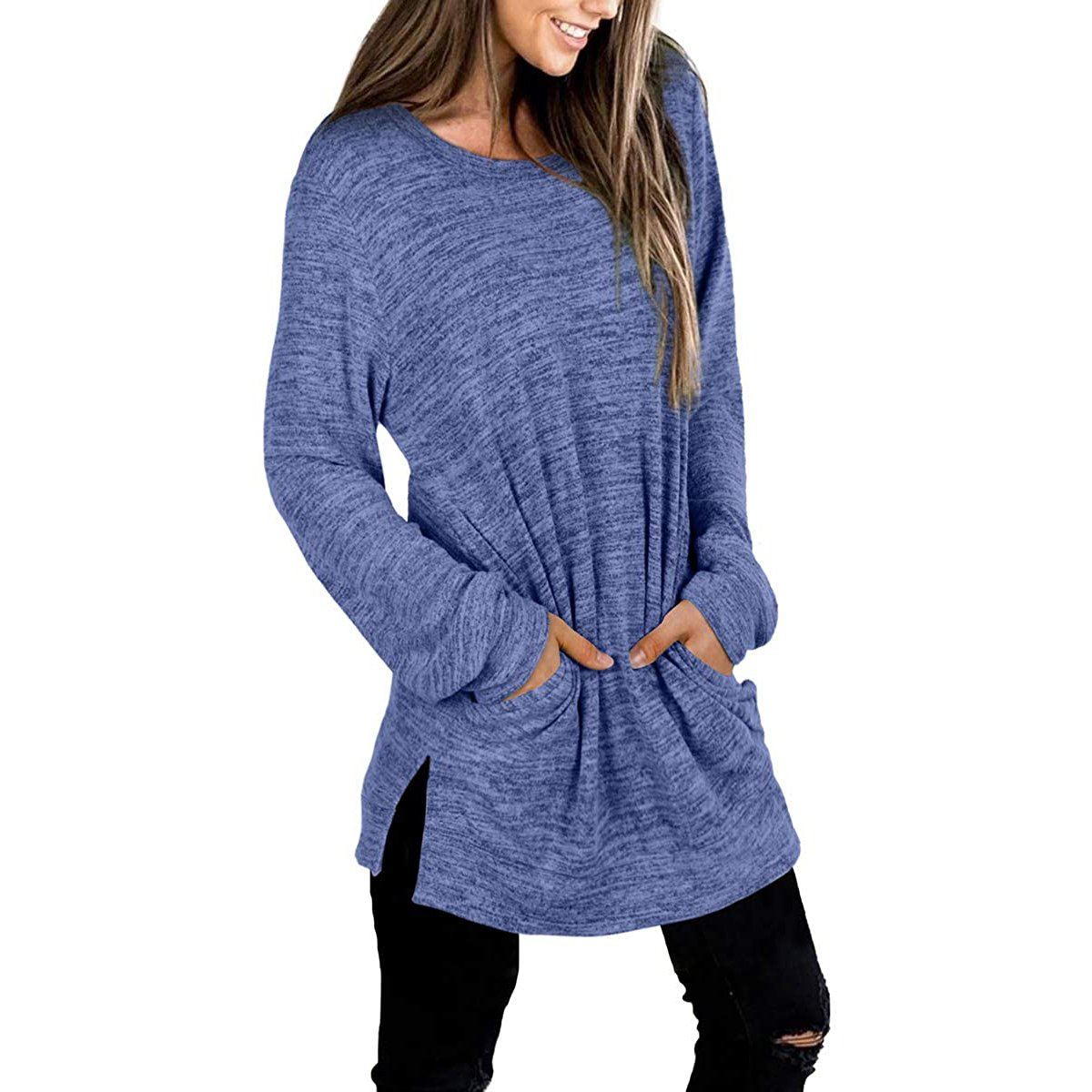 3/4 front view of a smiling woman with her hands in her pockets wearing a Women's Sleeve Oversized Casual Sweatshirts in blue