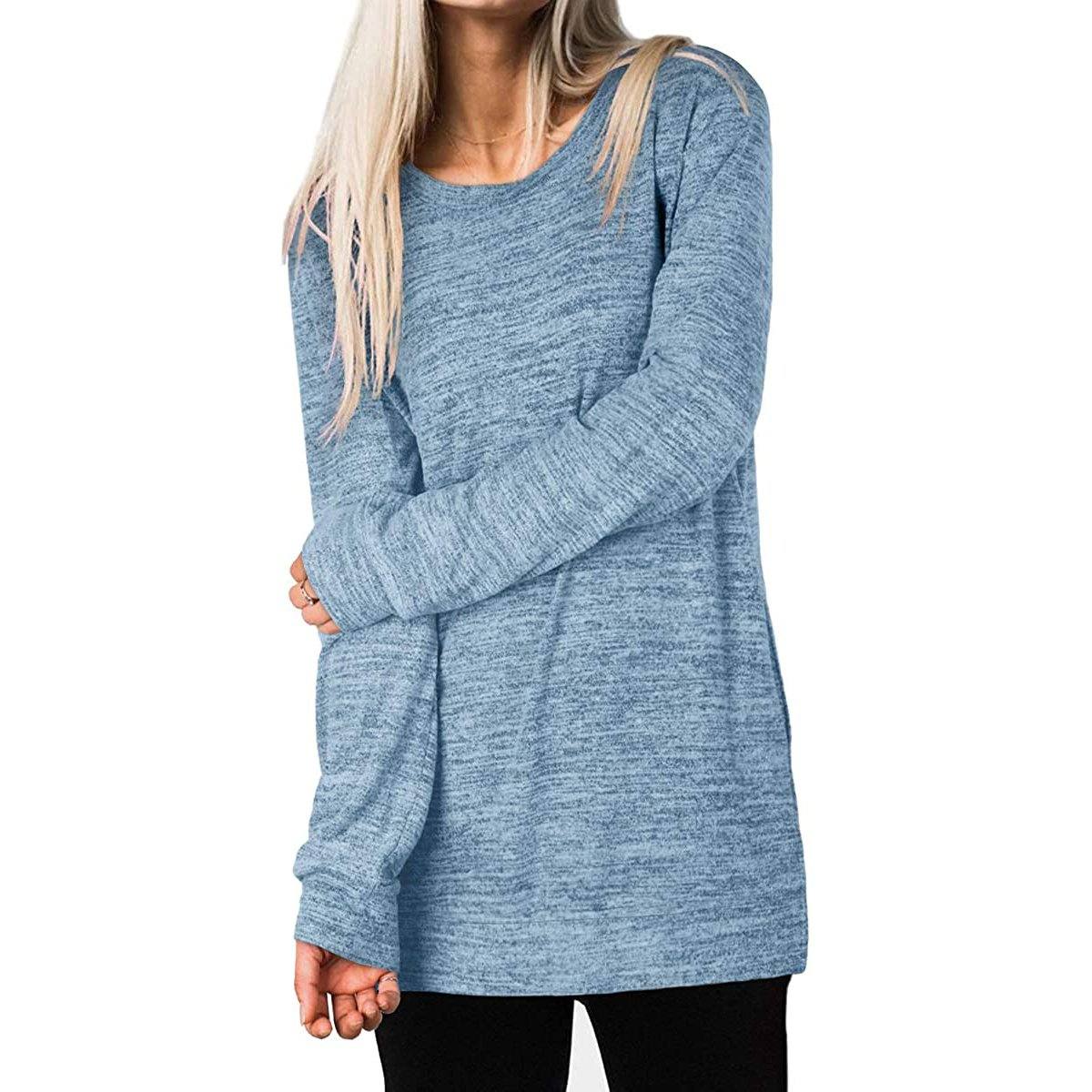 Woman holding one arm with her other hand wearing a Women's Sleeve Oversized Casual Sweatshirts in blue