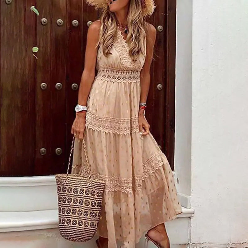 Woman holding a purse with one hand wearing a Sleeveless Solid Color Lace Panel Dress in beige